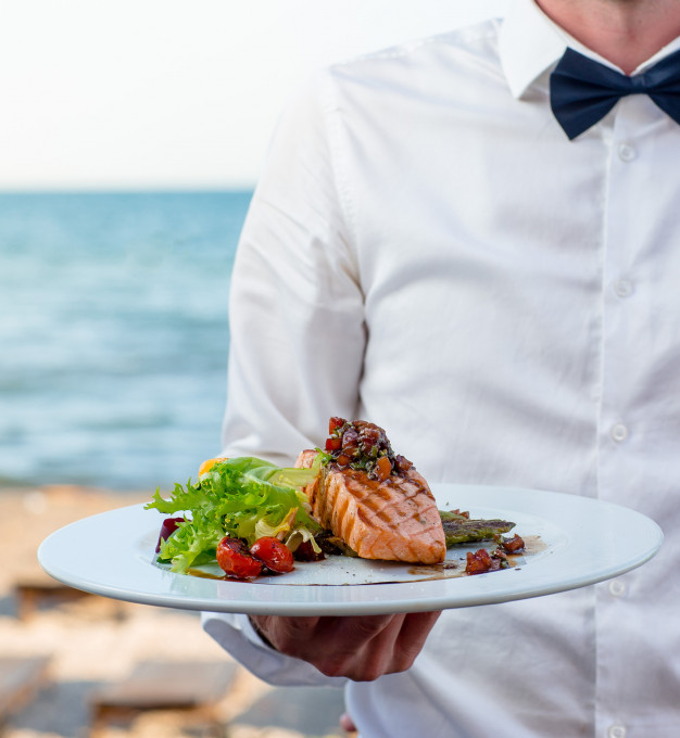 waiter-holds-plate-grilled-smoked-salmon-with-lettuce-tomato-pepper_140725-522.jpg